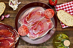 Spanish pan con tomate y jamon, bread with tomato and serrano ha photo