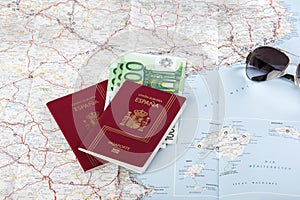 Spanish passports with european union currency and glasses on a