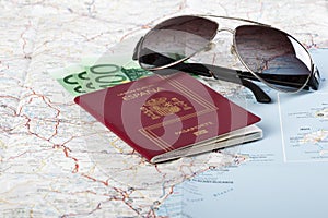 Spanish passports with european union currency and glasses on a