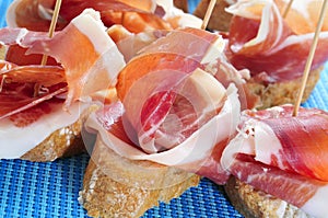 Spanish pincho de jamon, spanish ham served on bread photo