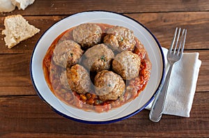 Spanish pisto (typical vegetables stew) with meatballs