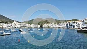 Spanish port full of boats and white houses photo