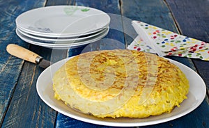 Spanish potato omelet on wooden background.