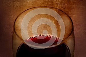 Spanish red wine Glass with bubbles on grunge arty background