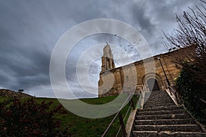 Spanish romanesque church in a stormy day with cloudy and dramatic sky , palencia, spain