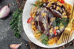 spanish sausage, blood sausage with sauerkraut. Food recipe background. Close up