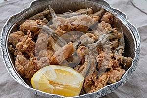 Spanish sea food, cripsy deep fried baby octopus, fish, calamari rings served with lemon