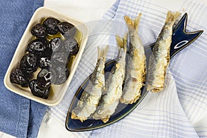 Spanish seafood mediterranean fish and olive tapas.