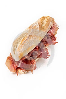 Spanish serrano ham sandwich isolated on white background