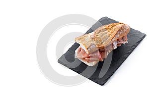 Spanish serrano ham sandwich isolated on white background. Spanish bocadillo de jamon serrano