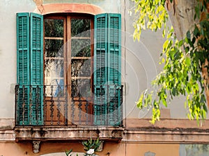 A Spanish shuttered window with balcony