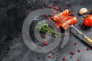 Spanish sliced chorizo sausage. cured meat. Black background. Top view. Copy space