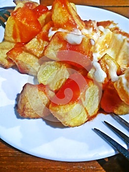 Spanish spicy potatoes typical tapa photo