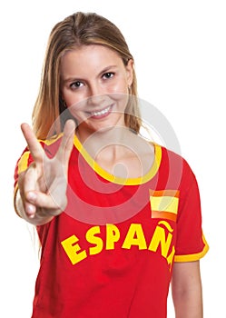 Spanish sports fan showing victory sign