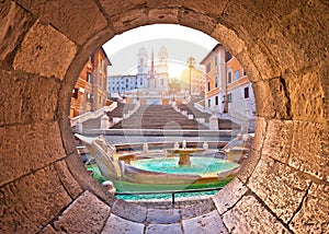 Spanish steps famous landmark of Rome morning view through stone window
