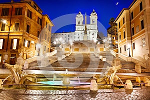 The Spanish Steps and the Fontana della Barcaccia in Piazza di Spagna in Rome at night photo