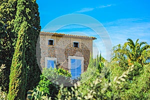 Spanish style house with plants and flowers located in Mallorca, Spain