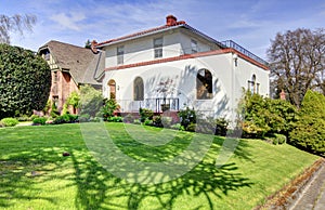 Spanish style white large home front exterior.