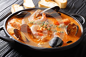 Spanish Suquet de Peix sea soup with potatoes, shrimps, mussels,