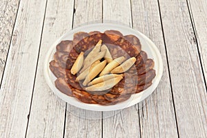 Spanish tapas of acorn-fed Iberian chorizo with peaks photo