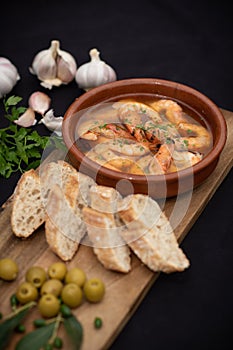 Spanish tapas with prawns garlic bread and olives