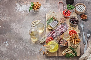 Spanish tapas set with salami, figs, cheese and bread, copy space