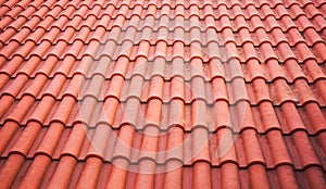 Spanish Tiles for roof. Red roof tiles on house as background image. Shingles roofing surface tiles overlay pattern