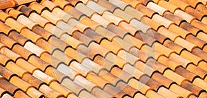 Spanish Tiles for roof. Red roof tiles on house as background image. Shingles roofing surface tiles overlay pattern