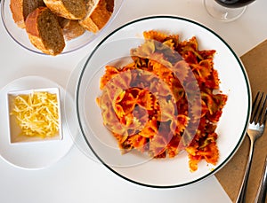 Lazos con tomate, spanish pasta in tomato sauce photo