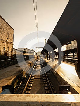 Spanish train station tracks at sunset