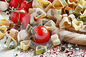 Spanish tricolor pasta corazones in the shape of hearts, cherry photo