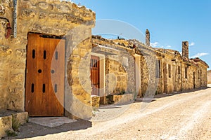 Spanish village street with traditional wineries BaltanÃ¡s, Castilla y Leon, Spain