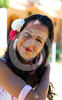 Spanish Woman in Feria Dress adjusts hair photo