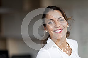 Spanish Woman Smiling At The Camera photo