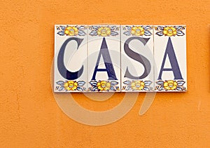 Spanish word CASA meaning house or home tiled on wall