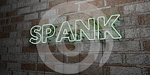 SPANK - Glowing Neon Sign on stonework wall - 3D rendered royalty free stock illustration photo