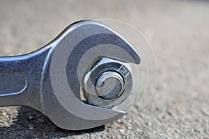 Spanner, bolt and nut close up.