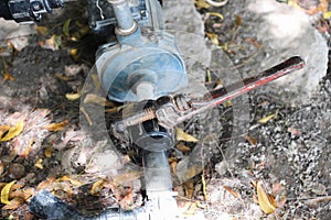 Spanner holding water pipe, connected to water impeller