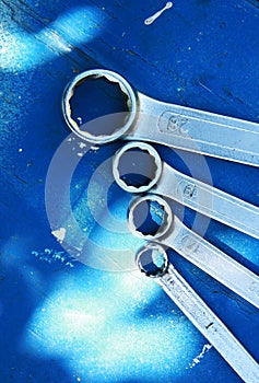 Spanners on blue table photo