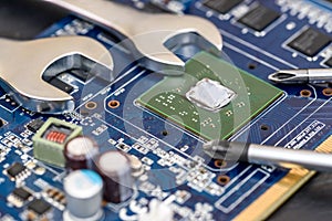 Spanners on motherboard close up, computer upgrade