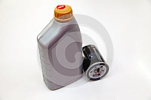 Spare part for car engine  filter for cleaning dust and dirt with one liter bottle or can of lubricant on a white isolated