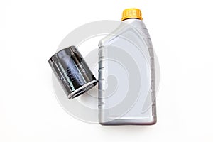 Spare part for car engine  filter for cleaning dust and dirt with one liter bottle or can of lubricant on a white isolated