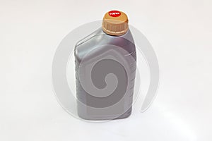 Spare part for car engine oil one liter bottle on a white  background. Maintenance and oil change in auto service