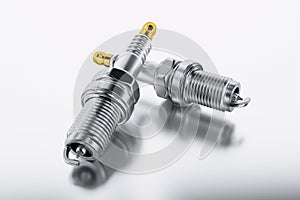 Spare parts spark plugs on white background for car and motorcycle