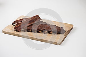 Spare ribs on wooden plate