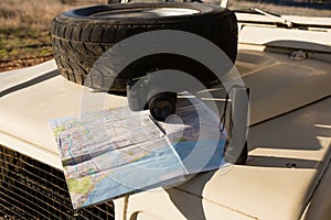 Spare tire with map on vehicle hood