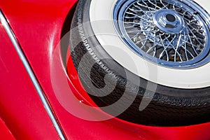 Spare tire on an red retro car