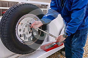 Spare tire removal from a utility trailer