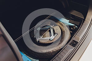 Spare tire in the trunk of a modern car.