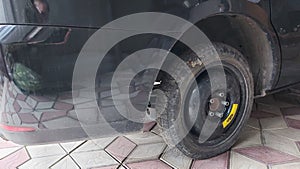 A spare wheel is installed on the machine, a small-sized spare wheel for an emergency drive is installed instead of the